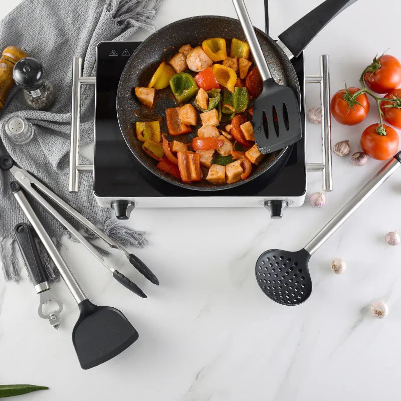 16-piece black silicone and stainless steel kitchen utensil set including spatulas and spoons.