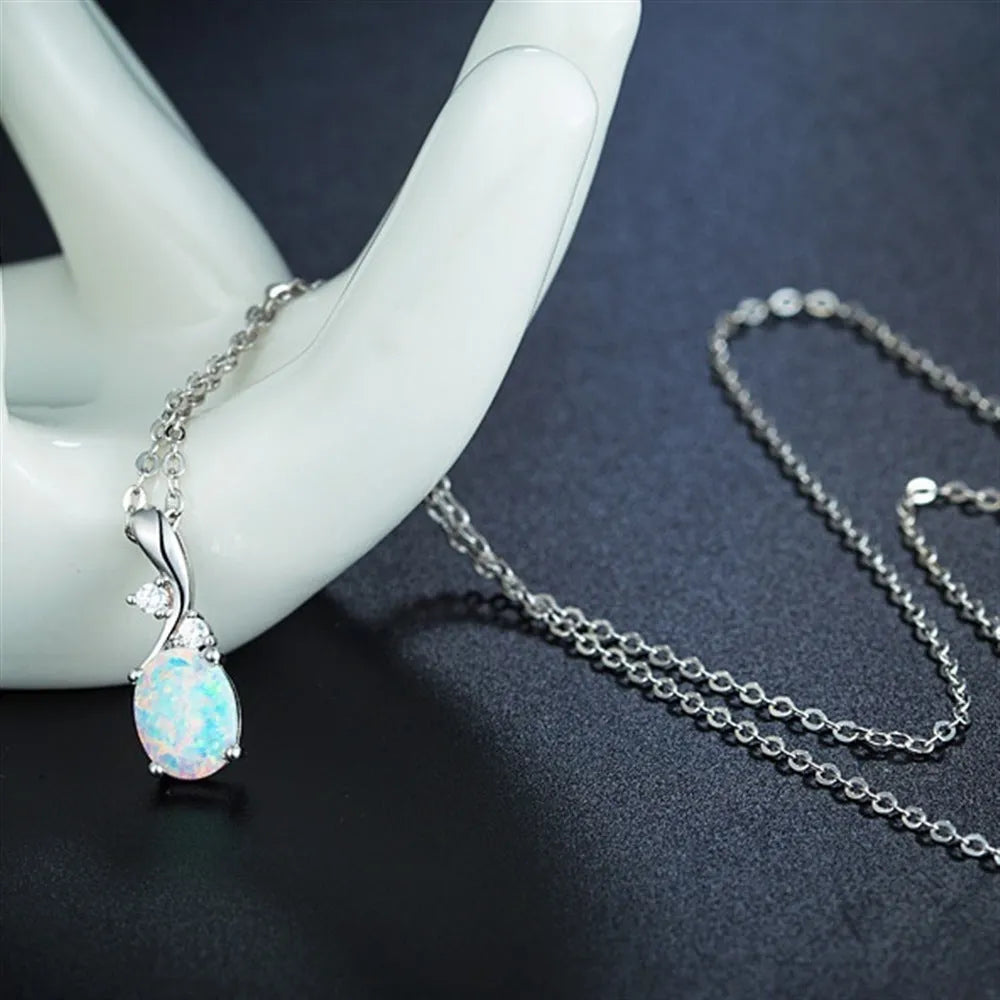 Water drop shaped opal pendant necklace on adjustable O-shaped chain in rose gold or white plating