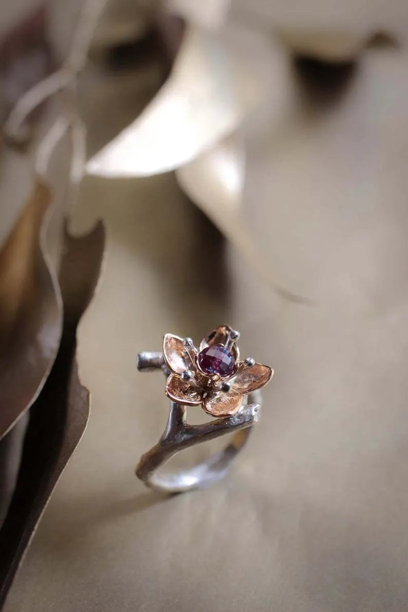 Women's two-tone floral geometric alloy ring in silver colour on display