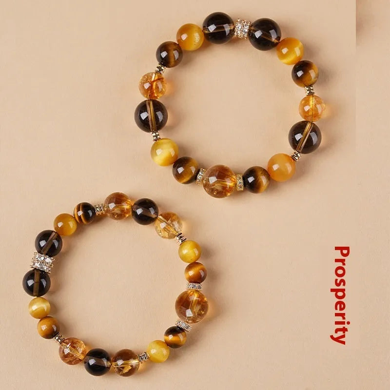 Yellow Tiger-eye crystal bracelet with 10mm geometric tower beads on wrist