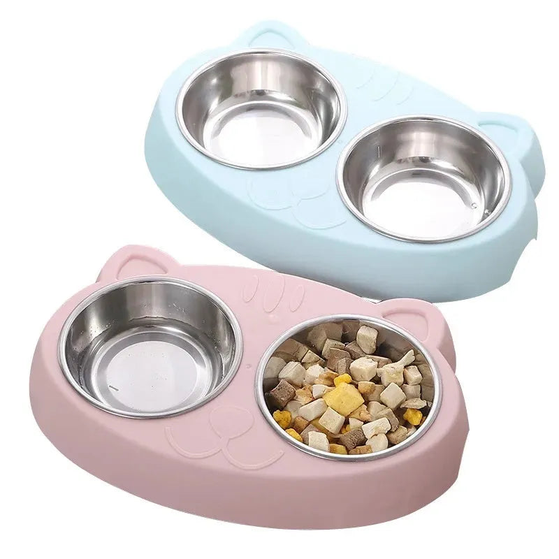 Blue macaron-shaped plastic pet feeder tray with two bowls for food and water.