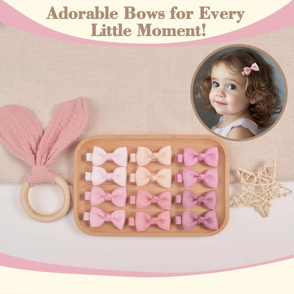 Assortment of pastel coloured baby hair clips and bows, including barrettes, laid out on a white background.