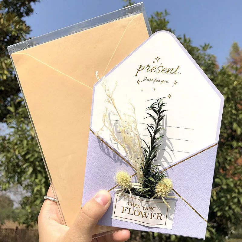 Handmade 3D butterfly-shaped birthday card with artificial flowers and hot foil stamping details.