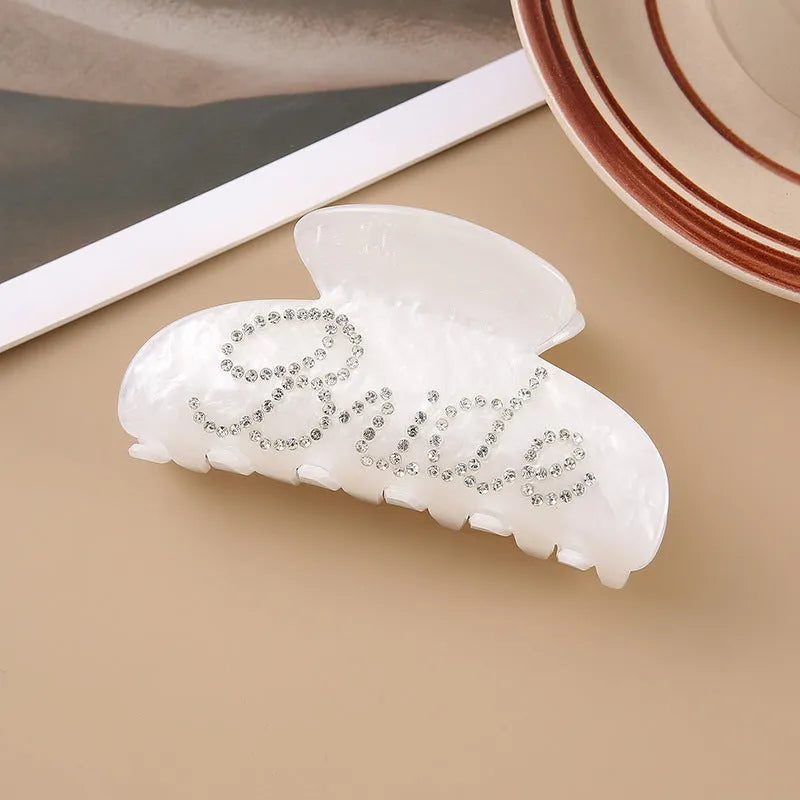 Pink acrylic hair claw clip with diamond pattern and English letters decoration, 10cm size