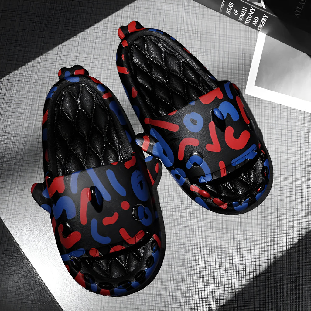 Pair of light beige open-toe EVA slippers with a shark design on a white background.
