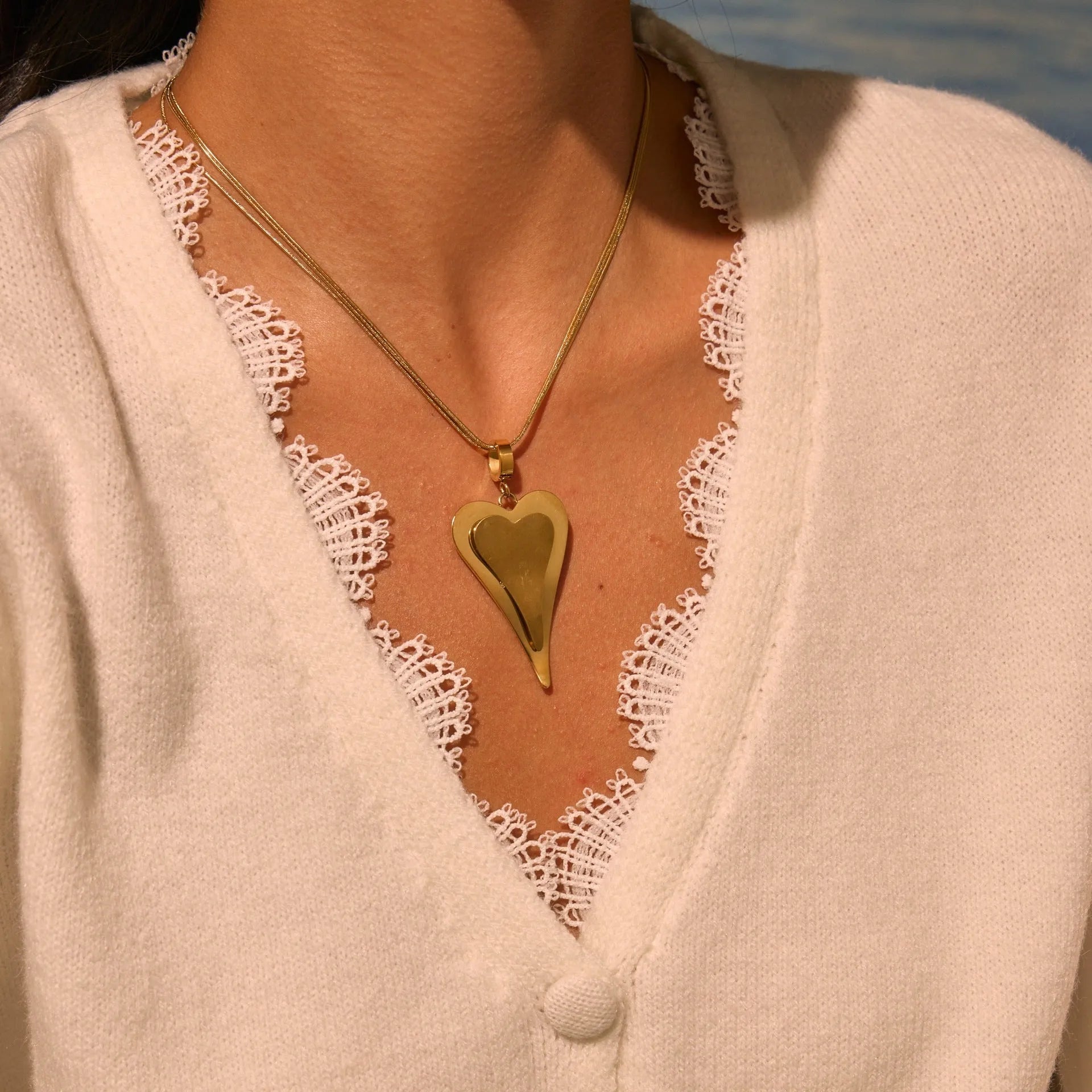 Geometric double heart and snake bones necklace in stainless steel with gold or steel finish on regular chain
