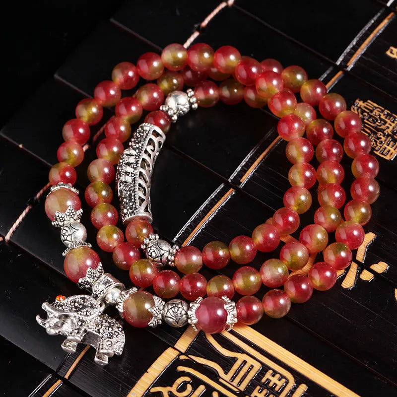 Natural watermelon crystal bracelet with Chinese knot design in 6mm and 8mm size options
