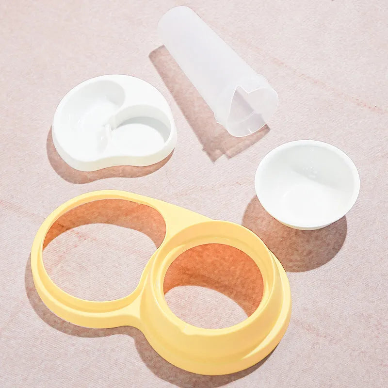 Grey and yellow dual ceramic pet feeding bowl with stainless steel insert and non-slip base.