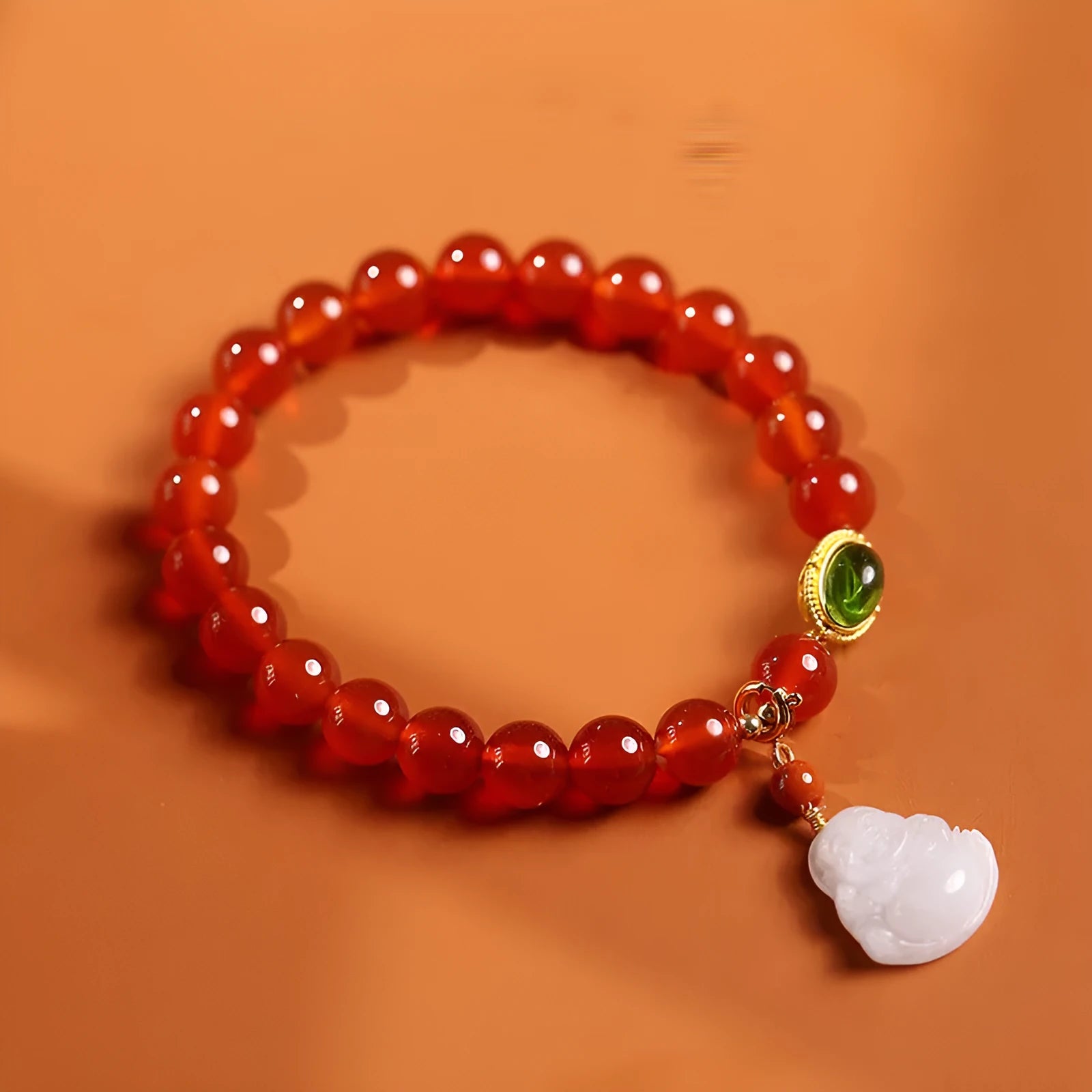 Handmade red agate and amber bracelet with Maitreya Buddha charm in Chinese geometric style.