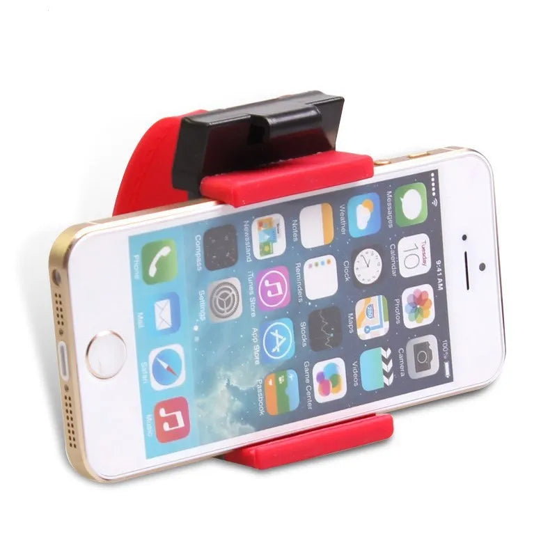 Black universal steering wheel phone holder clip mounted on a car steering wheel.