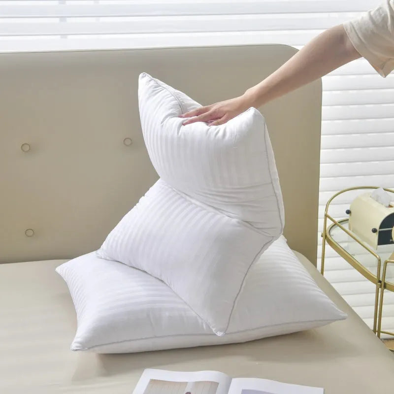 White cotton satin stripe pillow with feather cotton filler, shown in standard bedding size.