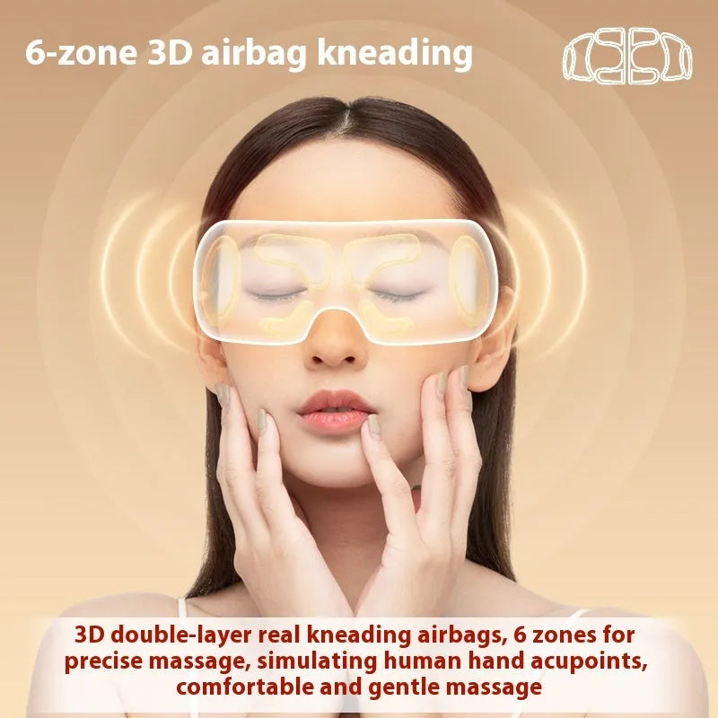 White rechargeable eye massager with airbag massage and hot compress functions on a table