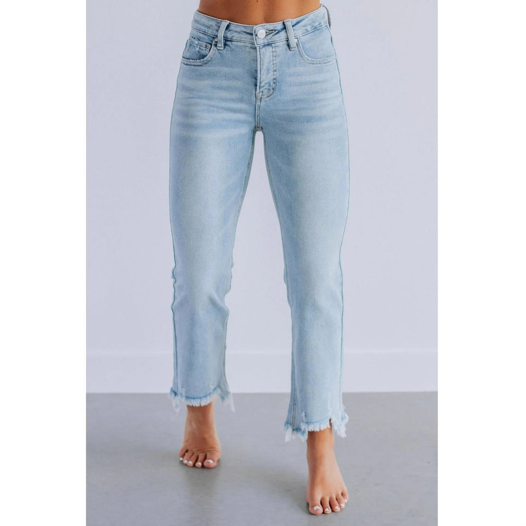 Women's solid colour denim jeans with a hand-worn finish, shown in dark blue and light blue.