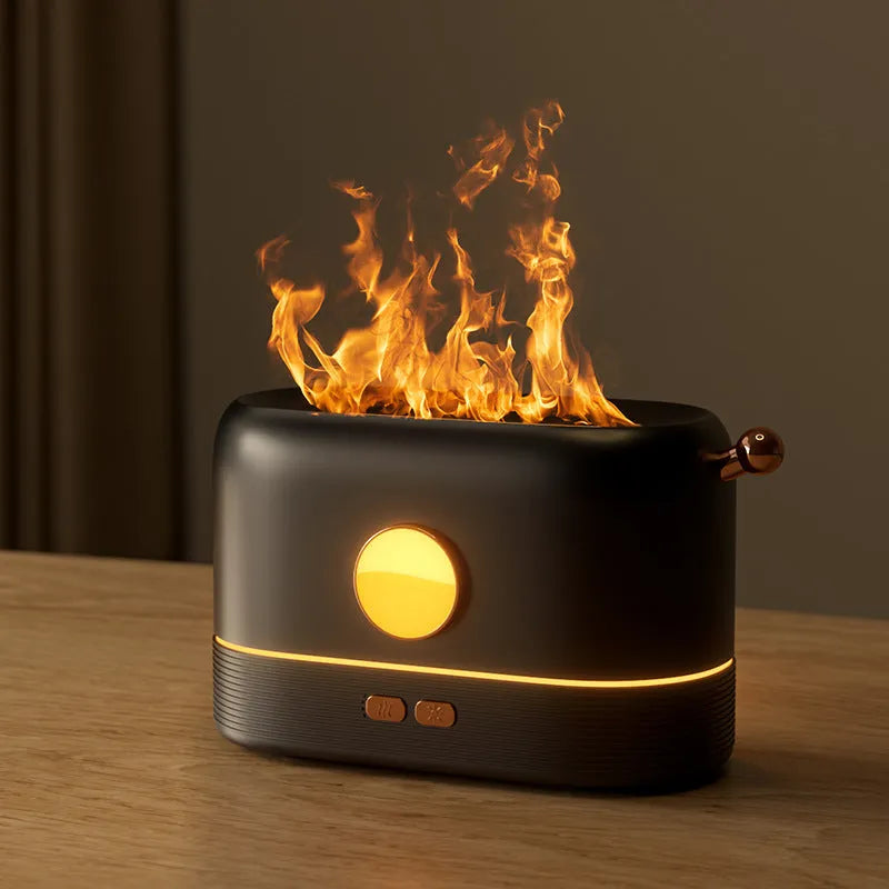 Black USB humidifier with simulated flame effect and water tank on wooden desktop