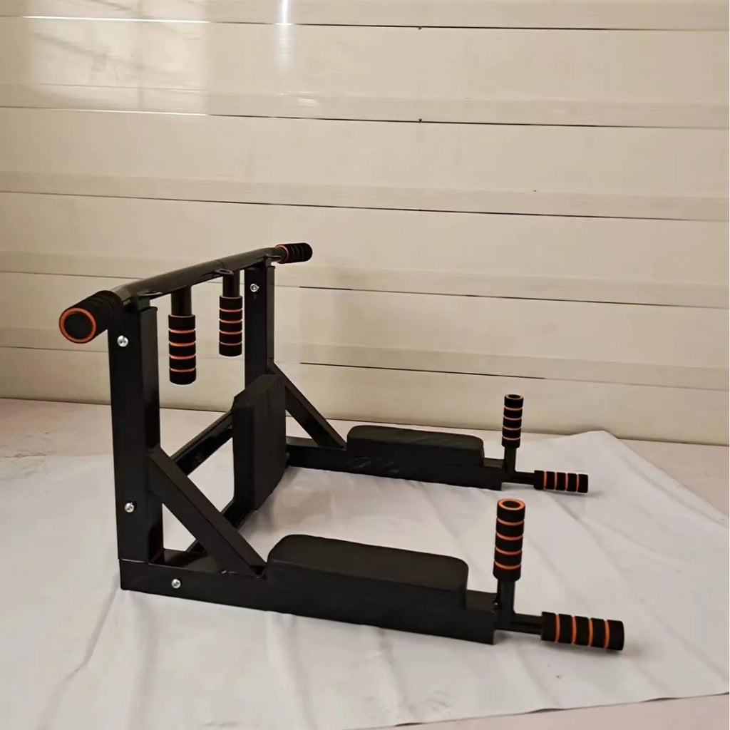 Black wall-mounted steel fitness station with sandbag rack above parallel bars and pull-up bar.