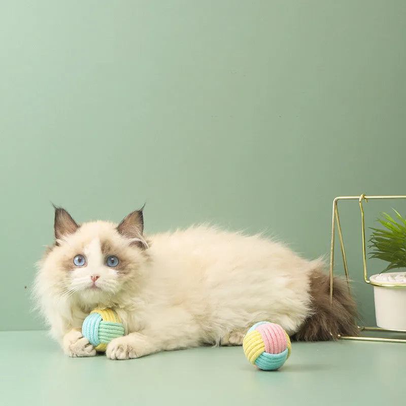 Handmade plush cotton cat hair ball toy in blue powder, green blue, and pink green colours