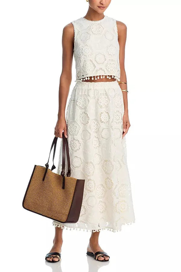 White women's two-piece suit with embroidered sleeveless top and long skirt in retro art style