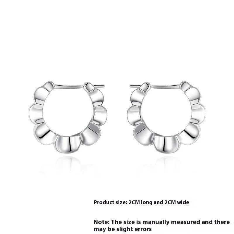 Pair of sterling silver geometric stud earrings with round decorative elements