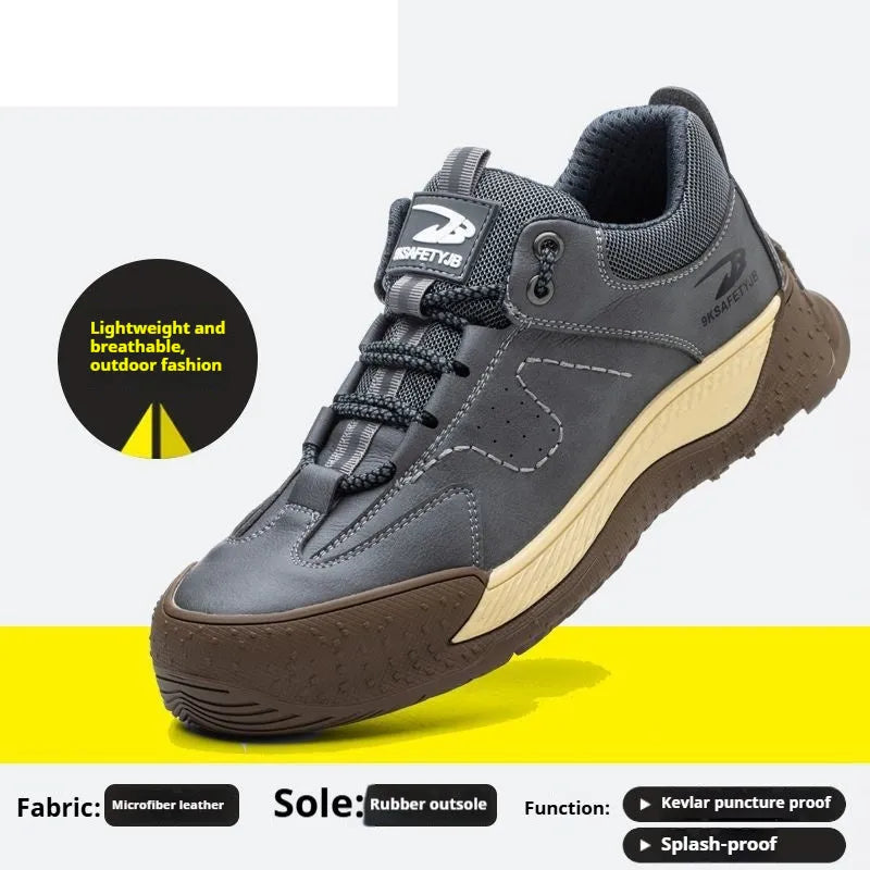 Men's black leather work safety shoe with Flyknit panel and rubber sole on a grey background.