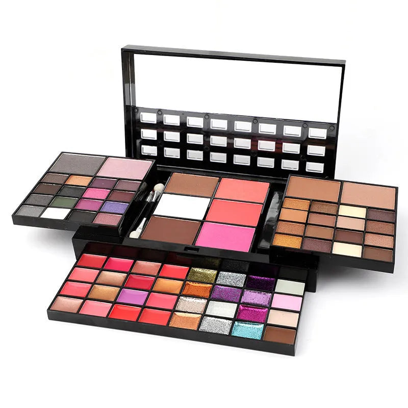 74 colour makeup palette open showing eyeshadow, lip gloss, blush and contour powders with brush and applicator