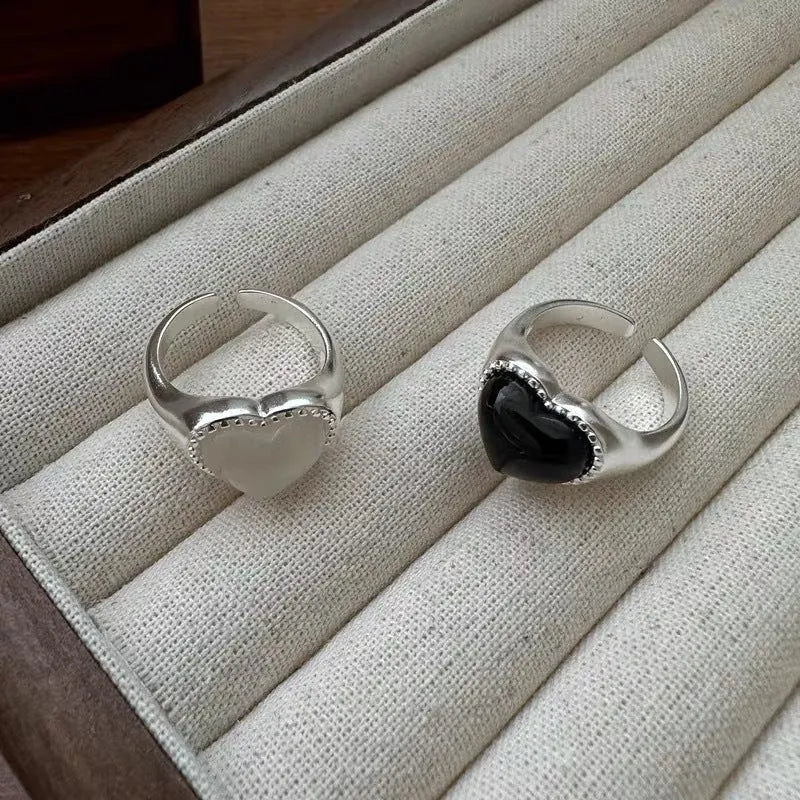 Adjustable sterling silver ring with heart-shaped black agate centrepiece showing open mouth design