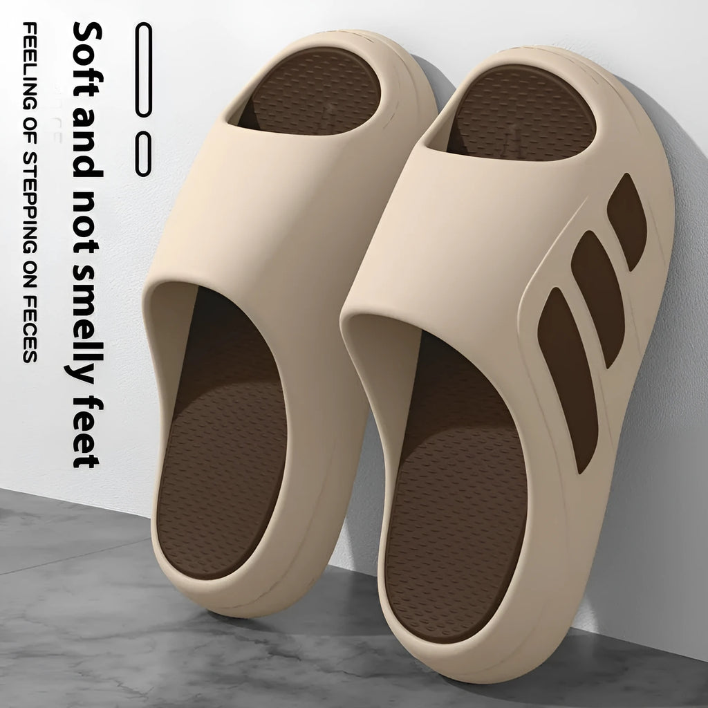 Men's and women's brown EVA platform slippers with a letter detail on the upper, shown on a white background.