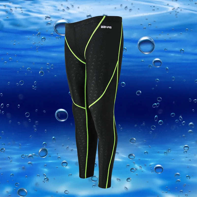 Men's black and grey line nylon cropped swimming trunks laid flat.
