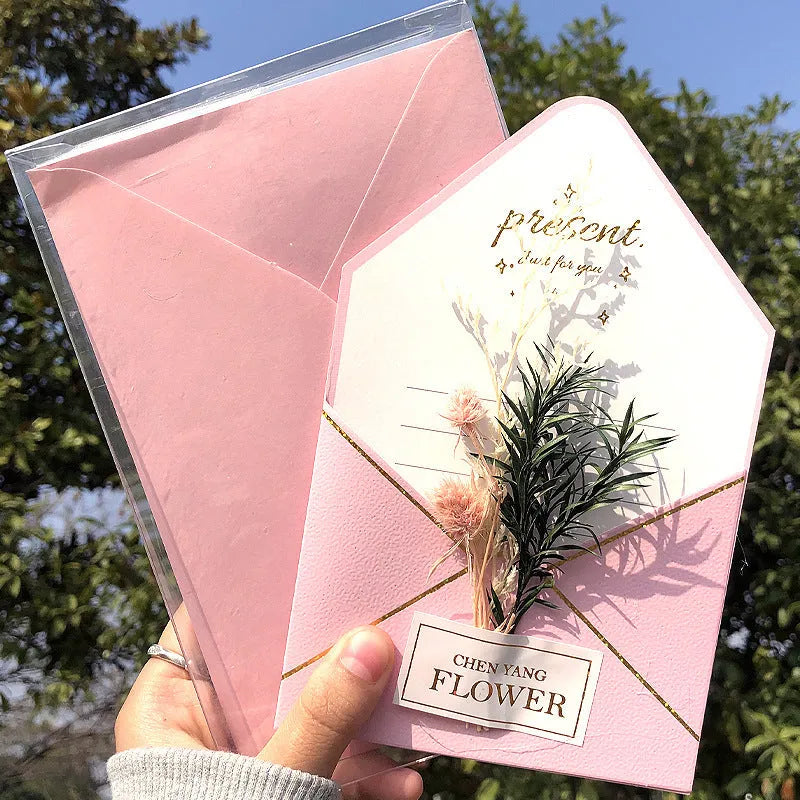 Handmade 3D butterfly-shaped birthday card with artificial flowers and hot foil stamping details.
