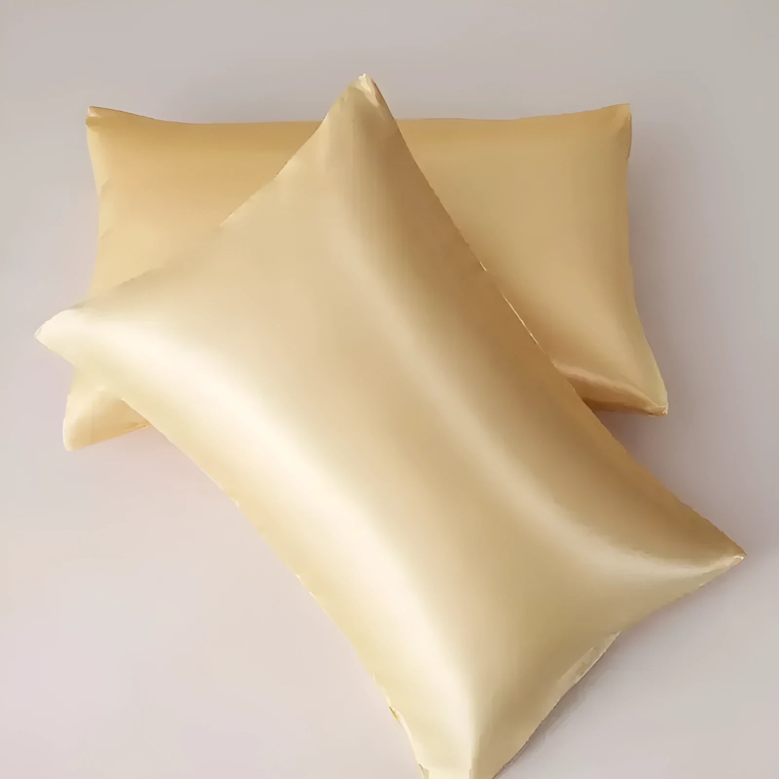 A pair of solid colour satin cloth pillowcases made from polyester chemical fibre, showing available colours and sizes.