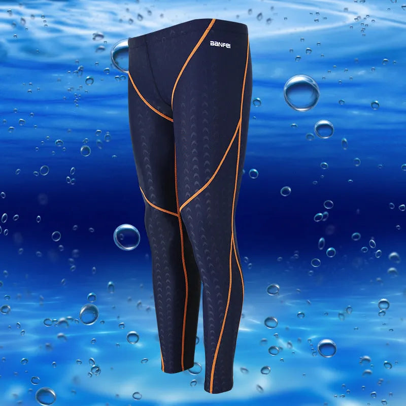 Men's black and grey line nylon cropped swimming trunks laid flat.