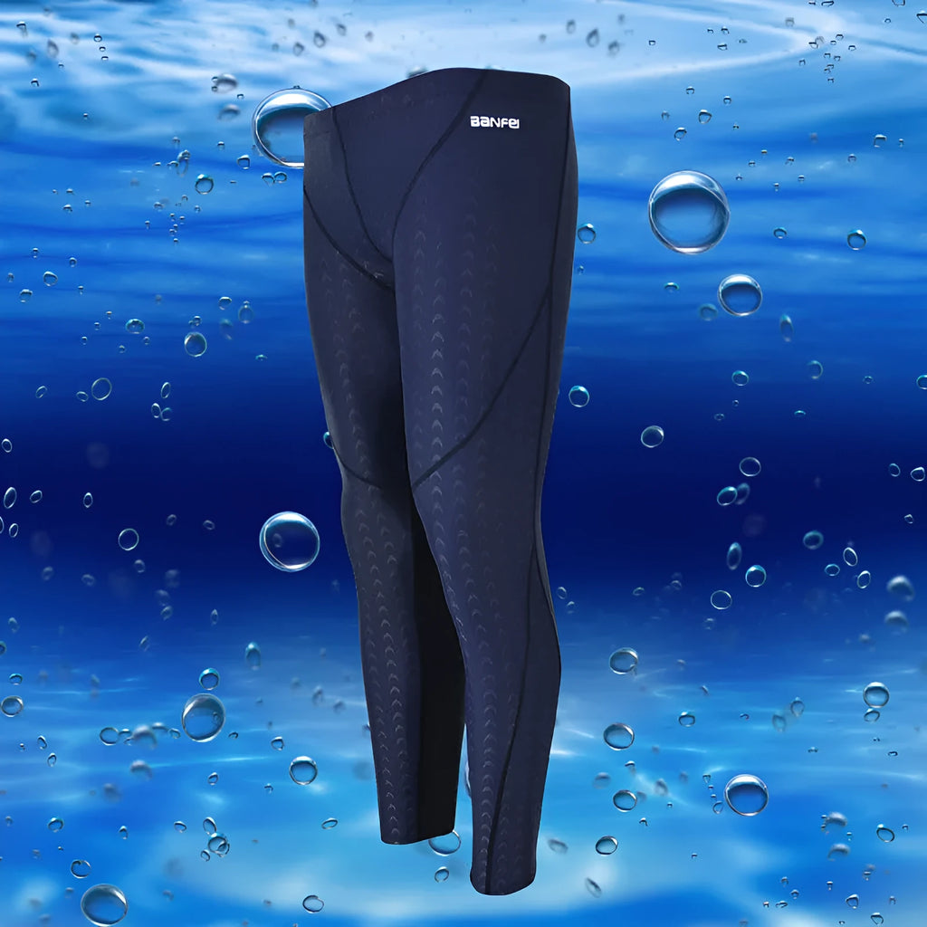 Men's black and grey line nylon cropped swimming trunks laid flat.