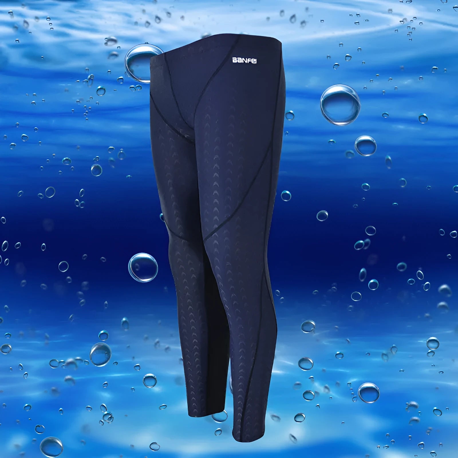 Men's black and grey line nylon cropped swimming trunks laid flat.