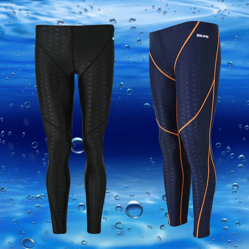Men's black and grey line nylon cropped swimming trunks laid flat.