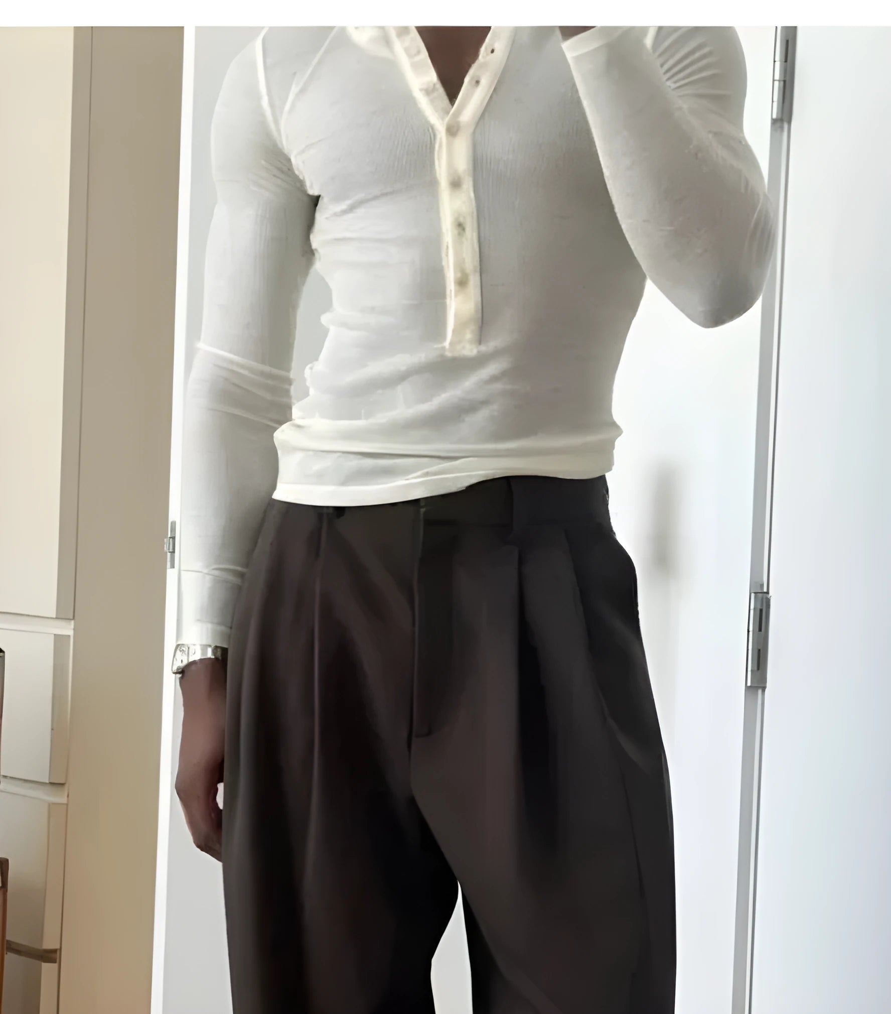 Cream coloured ribbed cotton blend men's henley top with long sleeves and button placket.