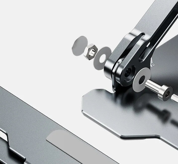 Grey aluminium adjustable laptop stand holding a silver laptop on a wooden desk.