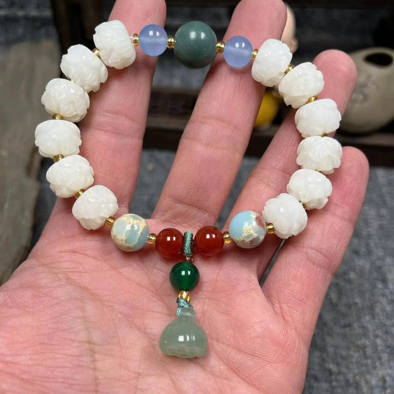Carved pumpkin lotus Bodhi root bracelet with white jade beads and multiple dimensions