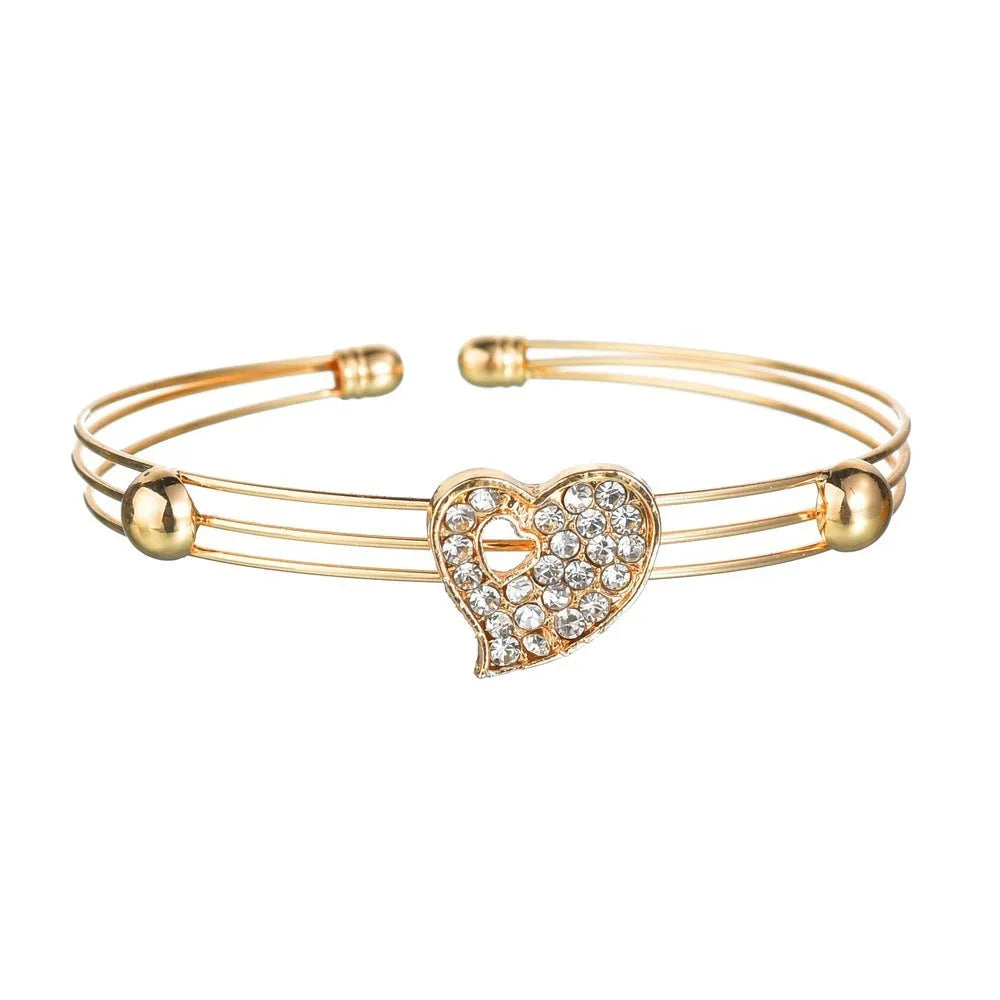 Gold electroplated love jewellery set with adjustable pendant, earrings, and hand decorations for women