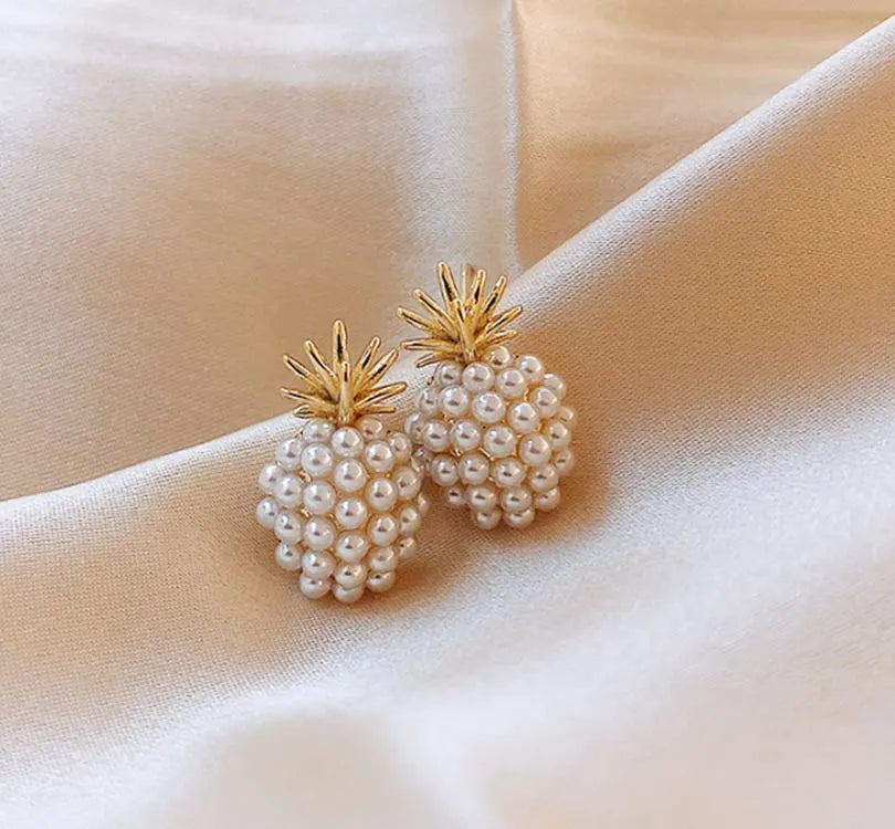 Pineapple and starfish motif drop earrings with pearl and artificial gemstone details on alloy metal