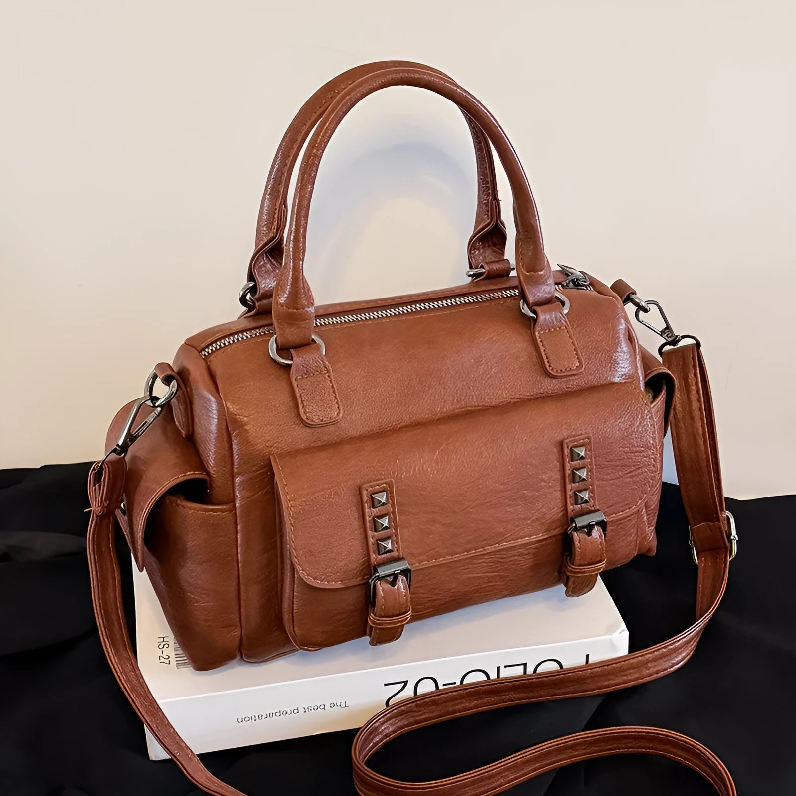 Vintage style square messenger bag in PU leather with visible stitching, shown in multiple colour options.