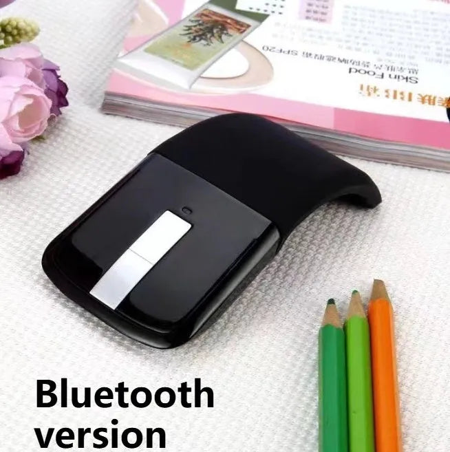 Black folding Bluetooth wireless mouse showing compact 14.5mm thickness when folded for portable laptop use