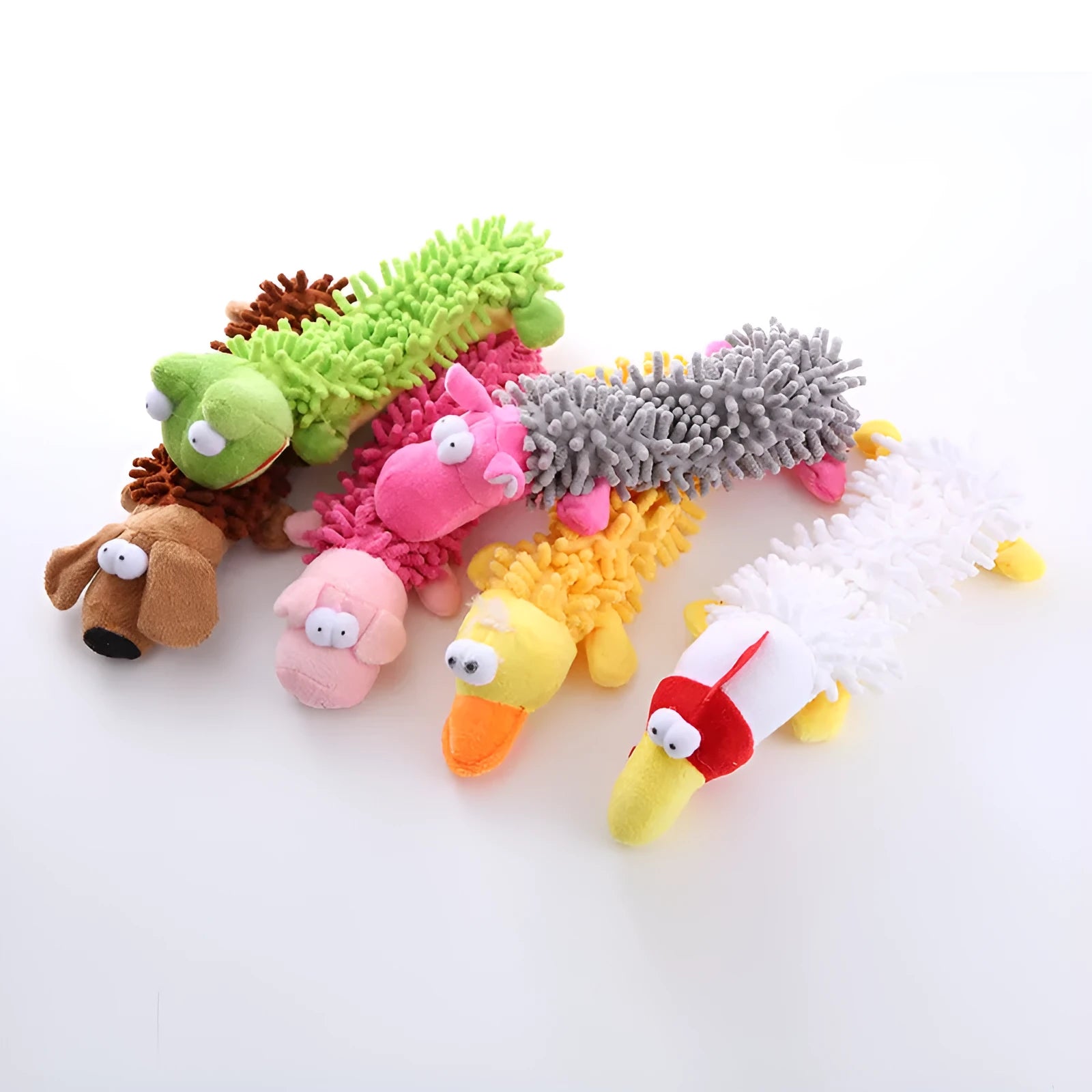 Soft brown plush dog toy shaped like a molar with animal print, alongside yellow duck and white chicken versions.