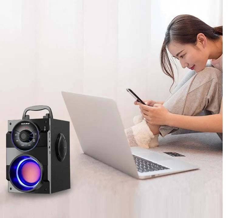 Black portable mini home audio system with subwoofer, satellite speakers, and USB charging cable