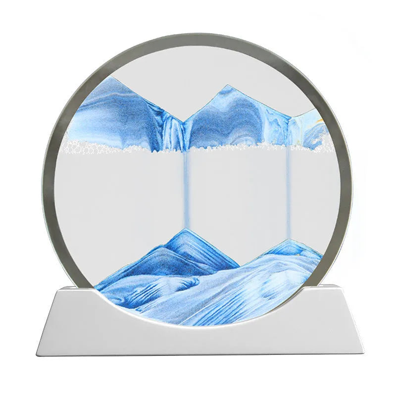 12-inch tall rotary quicksand night lamp with coloured sand in a modern glass base on a desktop.
