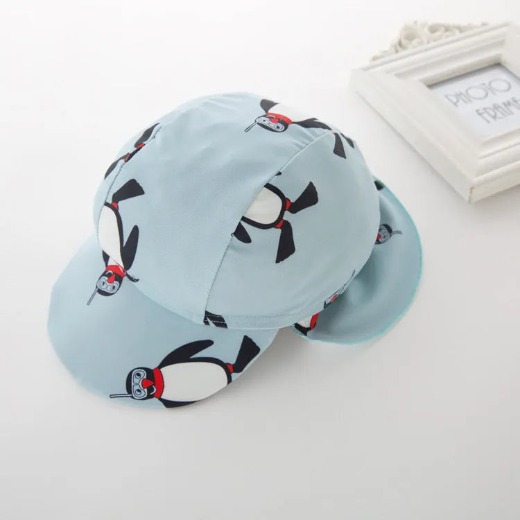 Boys' penguin print long sleeve swimsuit with matching swimming cap set