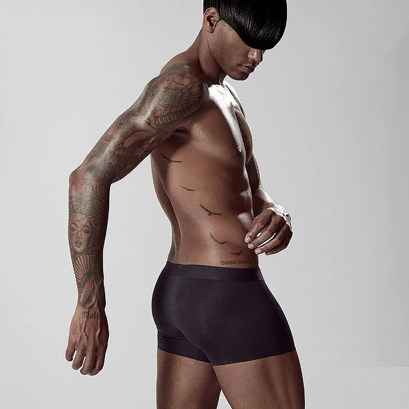 Green seamless modal men's mid waist underwear laid flat