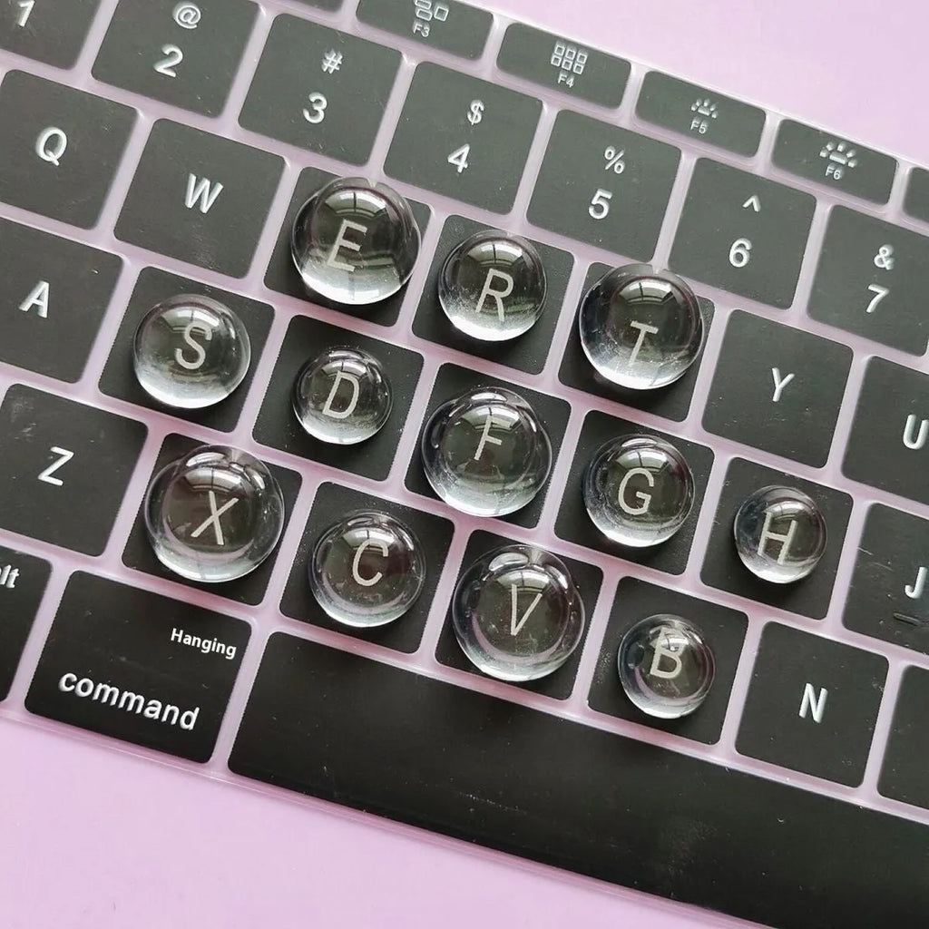 Set of PVC crystal glass ball keyboard stickers in 12x6mm size on a keyboard showing raised transparent domes