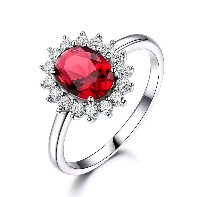 Women's floral ring with blue moissanite stone on electroplated copper band, shown in green, sapphire blue, and pomegranate red colour options.