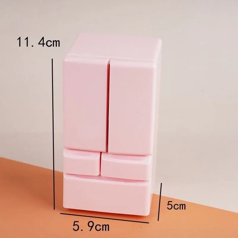 White plastic miniature candy toy model with light-up feature displayed on surface