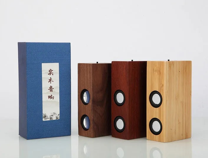 Wooden Bluetooth speaker in bamboo, black walnut, or sapele finish with 7-hour battery.