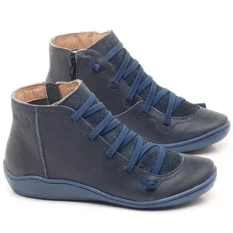 Women's black casual flat ankle boots with a round toe and wedge heel on a rubber sole.